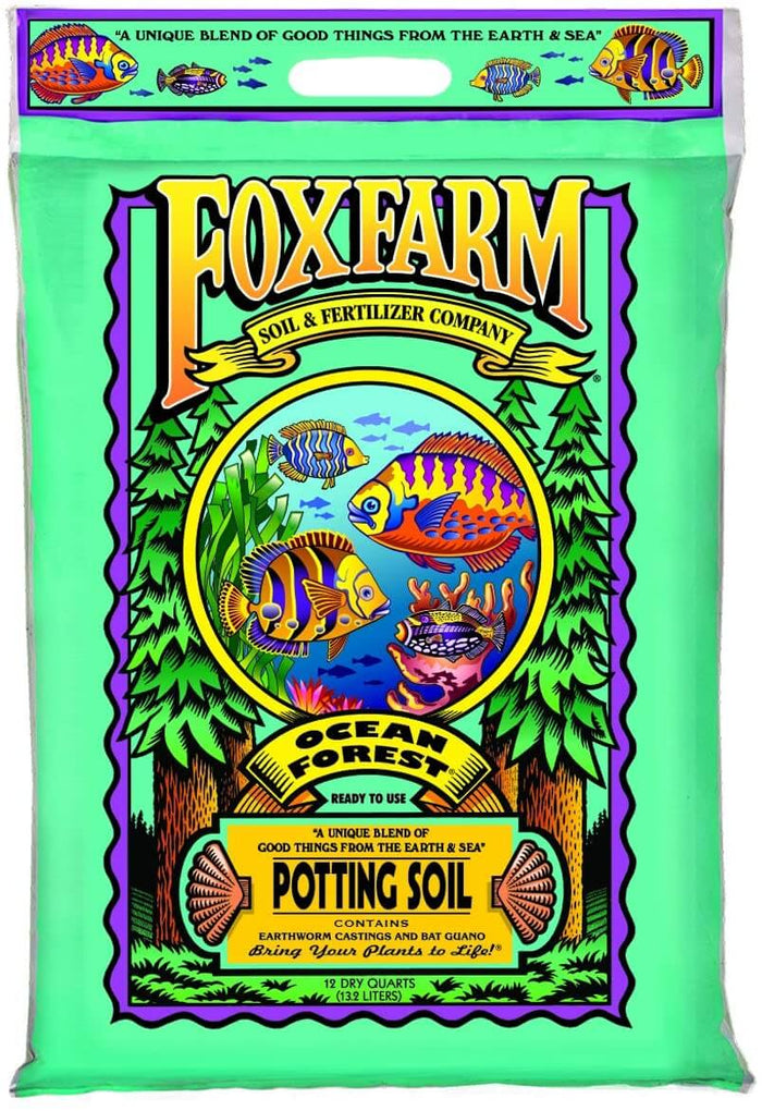 A light green bag of FoxFarm potting soil featuring an underwater fish illustration and pine tree borders.