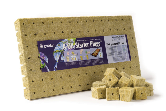Sheet of 98 tan Grodan mineral wool starter plugs with a purple instructional label and several loose cubes.