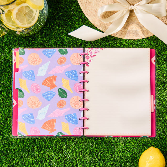 Open Happy Little Vibes - Dotted Lined Classic Notebook - 60 Sheets on grass with seashell patterned inner cover and blank lined page, next to a sun hat and lemonade pitcher