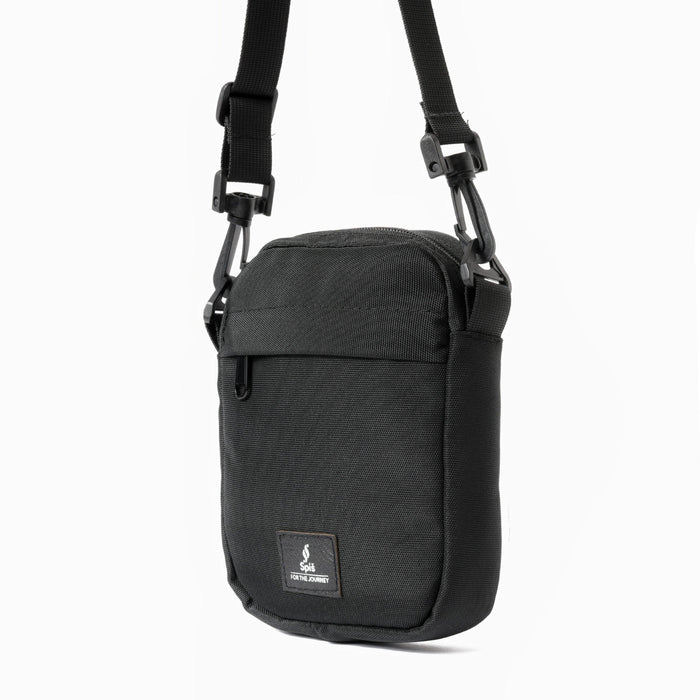 Black cross bag sling bag with adjustable strap and front pocket, minimalist travel style