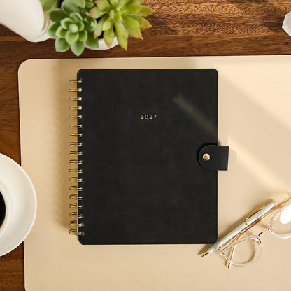 2027 Midnight Customizable Spiral Citrine Planner - Classic Professional Layout - 12 Months shown as a black spiral planner with gold rings and snap closure