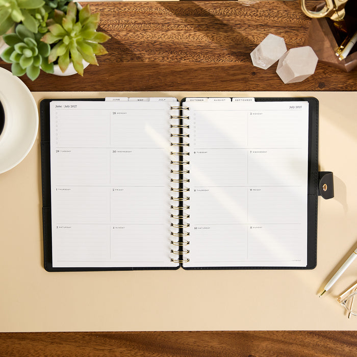 2027 Midnight Plaid Customizable Spiral Citrine Planner - Classic Professional Layout - 12 Months open to a clean weekly planning spread on a desk