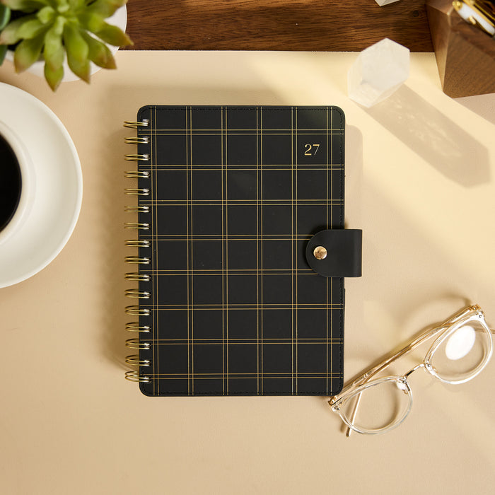 2027 Midnight Plaid Customizable Spiral Citrine Planner - Small Professional Layout - 12 Months shown closed with a black and gold plaid cover and spiral binding