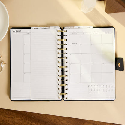2027 Midnight Plaid Customizable Spiral Citrine Planner - Small Professional Layout - 12 Months open to April 2027 showing monthly planning pages and lined notes space