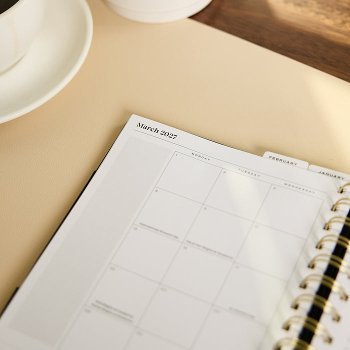2027 Midnight Plaid Customizable Spiral Citrine Planner - Small Professional Layout - 12 Months open to a March 2027 monthly calendar page with spiral binding