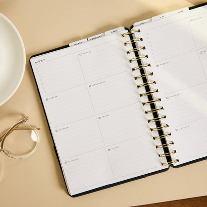 2027 Midnight Plaid Customizable Spiral Citrine Planner - Small Professional Layout - 12 Months open to a monthly calendar spread with spiral binding and lined planning sections