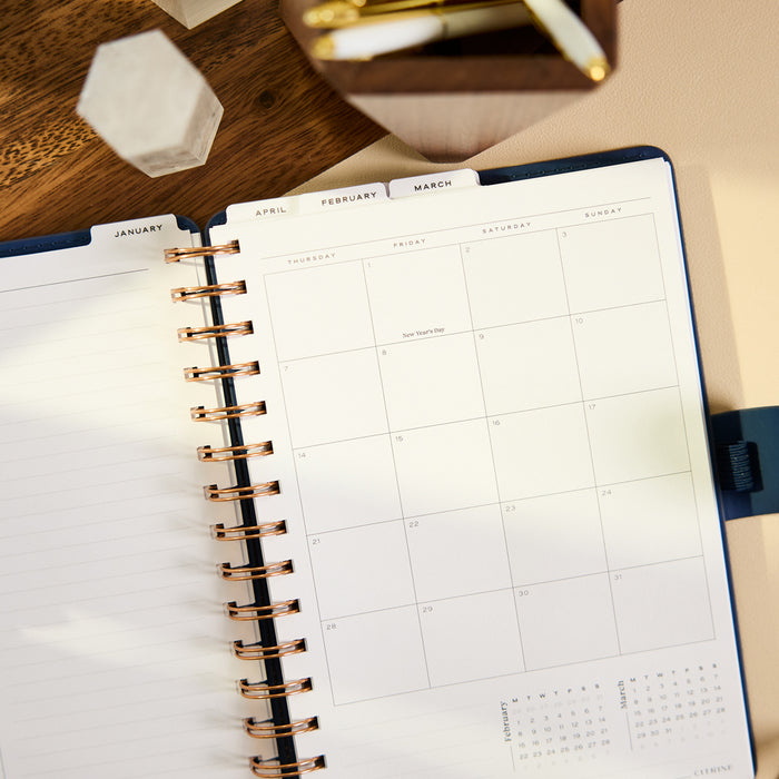 2027 Navy Herringbone Customizable Spiral Citrine Planner - Small Professional Layout - 12 Months open to a monthly calendar and lined pages
