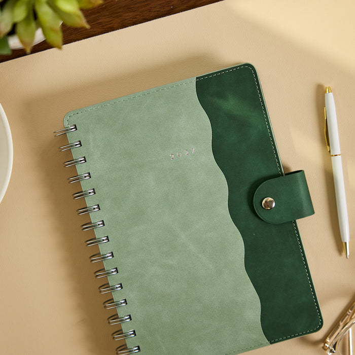 2027 Sage & Scallop Customizable Spiral Citrine Planner - Small Professional Layout - 12 Months green spiral planner with snap closure on desk