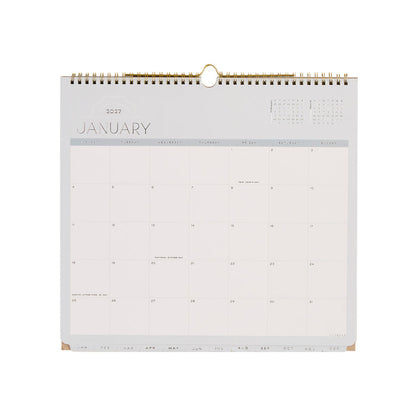 2027 Soft Frame Citrine Wall Calendar - Small - 12 Months displayed open to January 2027 with a clean monthly grid and gold wire binding