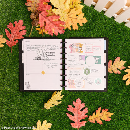 2027 SPECIALTY PEANUTS™ Customizable Planner - Classic Dashboard Layout - 12 Months open to illustrated dashboard pages with handwritten notes and stickersાન્ય