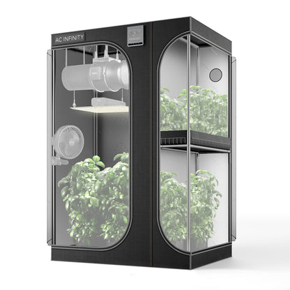 AC Infinity Cloudlab 743D black multi-chamber grow tent with internal plants, ventilation, and lighting on a white ground.