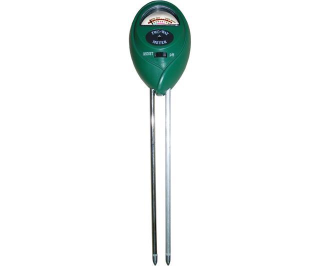 Green analog soil meter with dial gauge, toggle switch for moisture and pH settings, and two metal probe sensors.