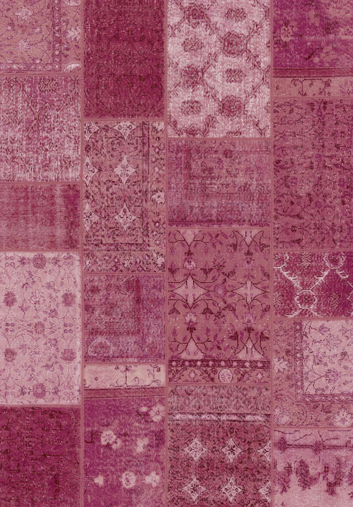 The Berry Patchwork - Washable Rug (JRN1040) showcases intricate vintage-style patterns in pink, magenta, and burgundy. Its rectangular patches feature unique floral and geometric designs—perfect for high-traffic areas.