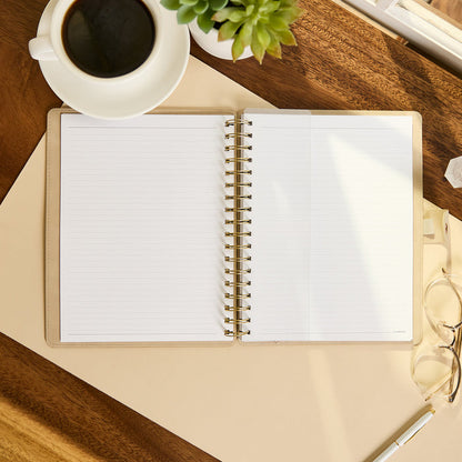 Citrine - Mocha - Classic Customizable Spiral Notebook open to lined pages on a wooden desk with coffee, succulent, glasses, and pen nearby