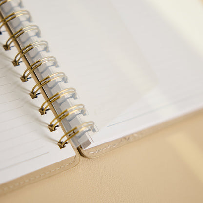 Citrine - Mocha - Classic Customizable Spiral Notebook open to lined pages with gold spiral binding and a warm mocha cover