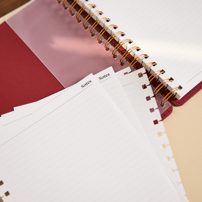 Citrine - Small Customizable Spiral Filler Paper with lined Notes pages beside a spiral notebook, featuring disc punched edges for planners and journals