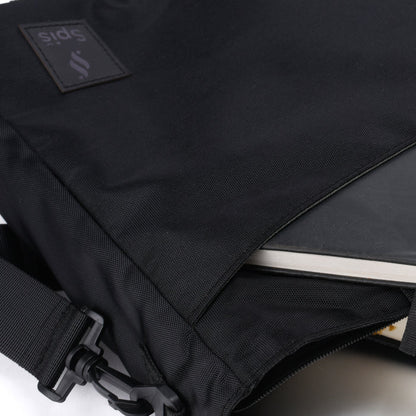 Black laptop messenger bag with visible pocket and adjustable strap