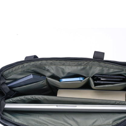 Top view of organized laptop bag interior with compartments for devices and accessories
