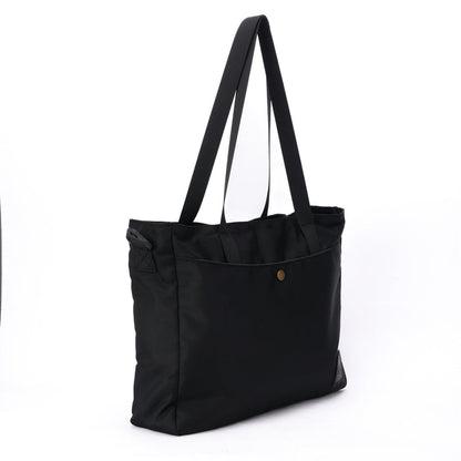 Black tote bag with long shoulder straps and front pocket against white background