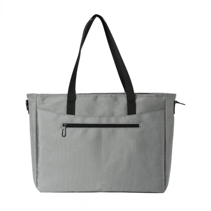 Gray tote bag with black handles and front zip pocket, travel or everyday accessory