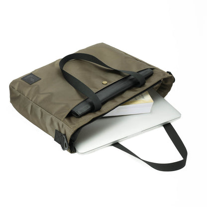 Khaki laptop bag with black handles, holding a laptop and books on a white background