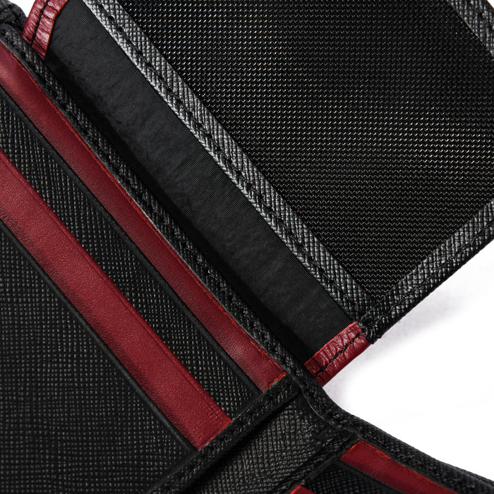 Close-up of black and red textured wallet interior with card slots and stitching detail