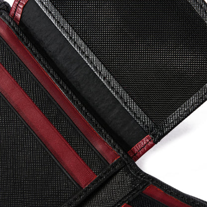 Close-up of black and red textured wallet interior with card slots and stitching detail