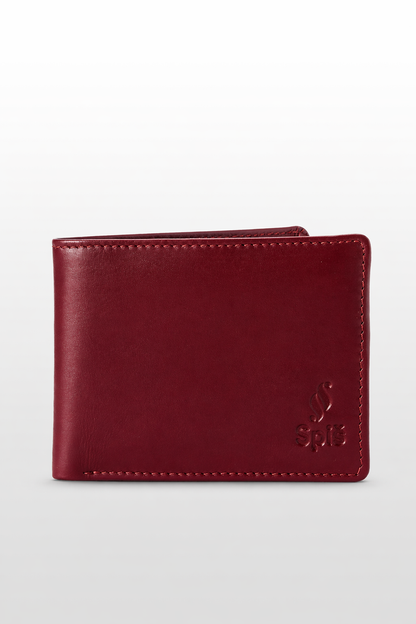 Slim burgundy leather bifold wallet with embossed logo on light background