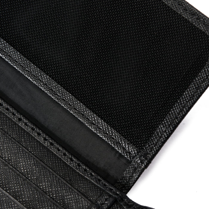 Close-up of black textured wallet interior with card slots and fabric lining