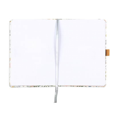 Open notebook showing two blank bullet dot grid pages with a ribbon bookmark, part of the Ditsy Wildflower - Bullet Dot Grid Happy Journal® - 80 Sheets - 160gsm Paper designed for journaling and planning.