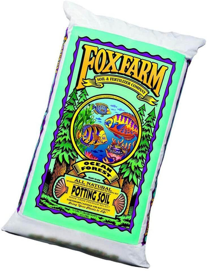 Bag of FoxFarm Ocean Forest Potting Soil featuring vibrant fish, forest, and coral graphics on a light green label.