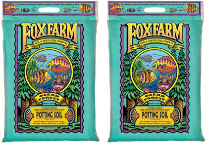 Two identical bags of FoxFarm Ocean Forest potting soil with a teal background and colorful fish illustration.