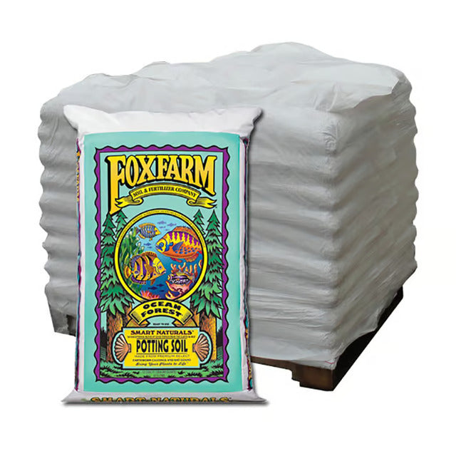 A pallet of FoxFarm Ocean Forest potting soil in 1.5 cubic foot plastic bags with a colorful, illustrated label.