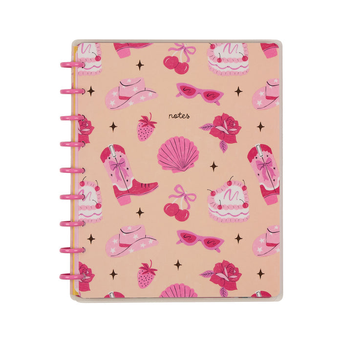 Happy Little Vibes - Dotted Lined Classic Notebook - 60 Sheets with a playful cover featuring pink cowboy boots, hats, sunglasses, strawberries, cakes, roses, cherries, and seashells on a peach background.