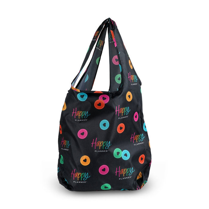 Black reusable shopping tote featuring colorful circular patterns and the words Happy Plans - Reusable Shopping Tote and Happy Planner printed throughout the design.