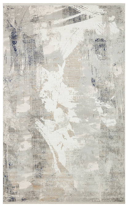 Grey, white, and navy abstract rug with a distressed, brushstroke-inspired pattern.