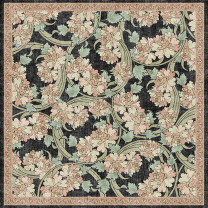 Black rug with a floral pattern of pink peonies and sage green leaves, featuring a decorative pink border.