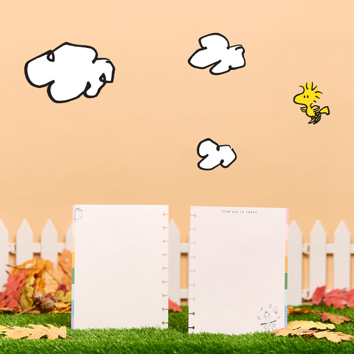 PEANUTS™ - Dotted Lined Classic Filler Paper - 40 Sheets shown as two disc bound planner pages with Peanuts character artwork in an outdoor setting