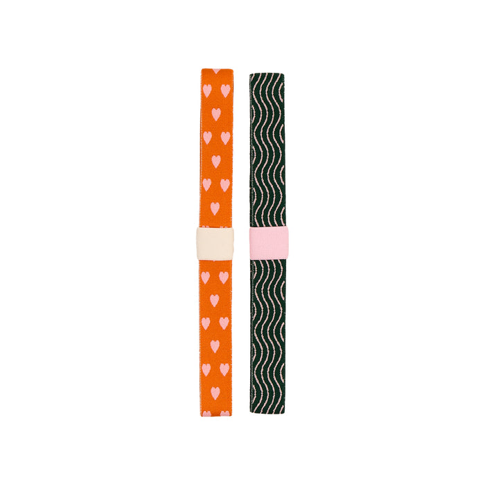 Screen Free Society - Elastic Band Pen Holder - 2 Pack featuring two colorful elastic pen holders with heart and wave patterns for planners and notebooks