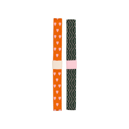 Screen Free Society - Elastic Band Pen Holder - 2 Pack featuring two colorful elastic pen holders with heart and wave patterns for planners and notebooks