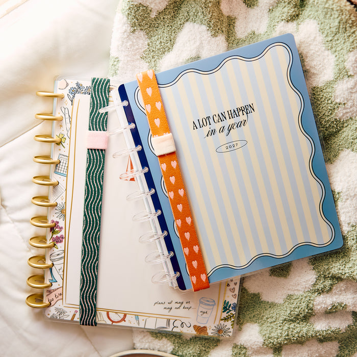 Screen Free Society - Elastic Band Pen Holder - 2 Pack shown on two colorful disc bound planners with orange and green elastic bands