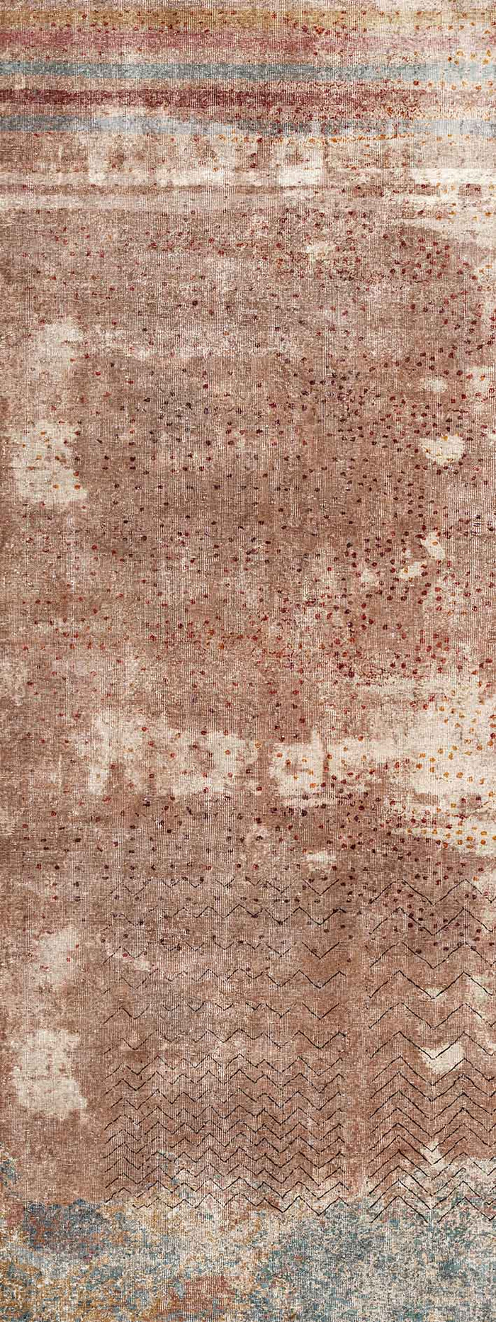 Terracotta rug with a distressed texture, dotted pattern, chevron accents, and horizontal striped borders.
