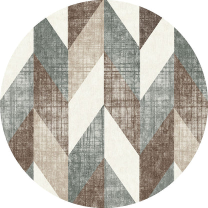Round rug with a geometric chevron pattern in shades of brown, grey, and cream with a textured, distressed finish.