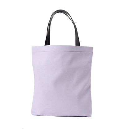 Lavender canvas tote bag with black handles on white background