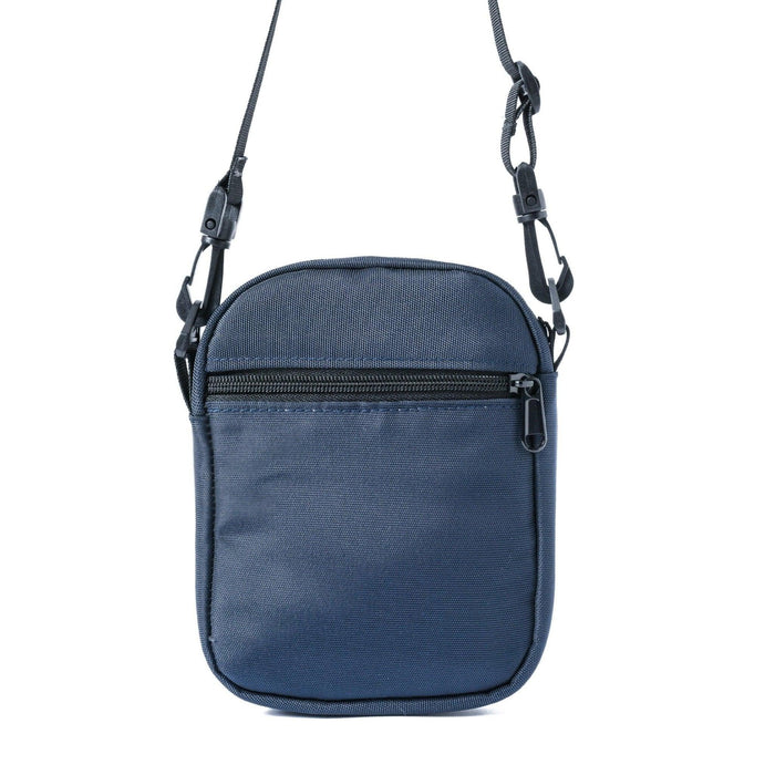 Blue mini cross bag with adjustable shoulder strap and front zipper pocket on white background